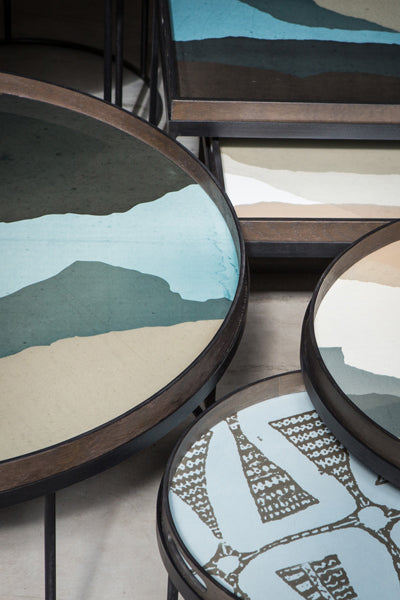 Tray Coffee Table by Ethnicraft, showing closeup view of tray coffee tables set in live shot.