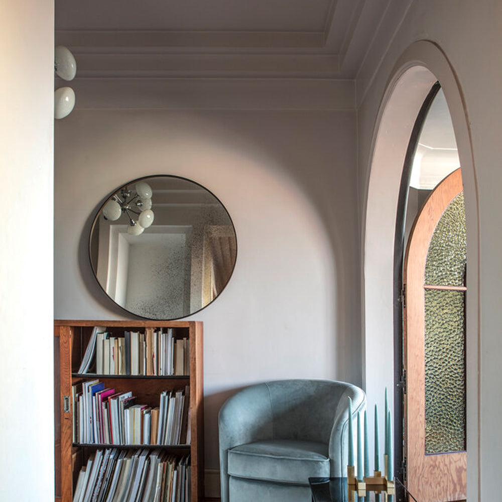 Aged Wall Mirror by Ethnicraft, showing front view of bronze wall mirror in live shot.