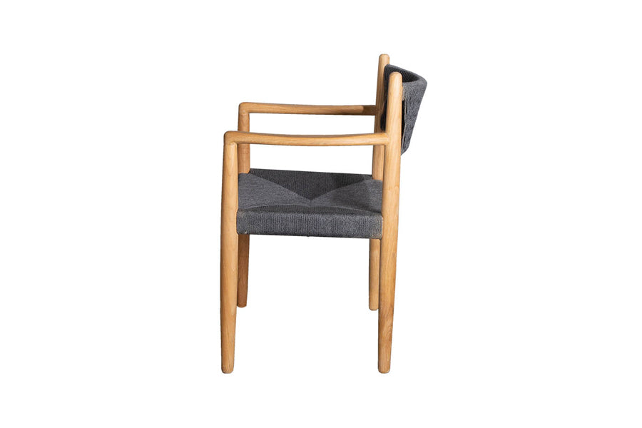 Royal Outdoor Dining Armchair by Cane-Line, showing side view of royal outdoor dining armchair in soft rope with teak.