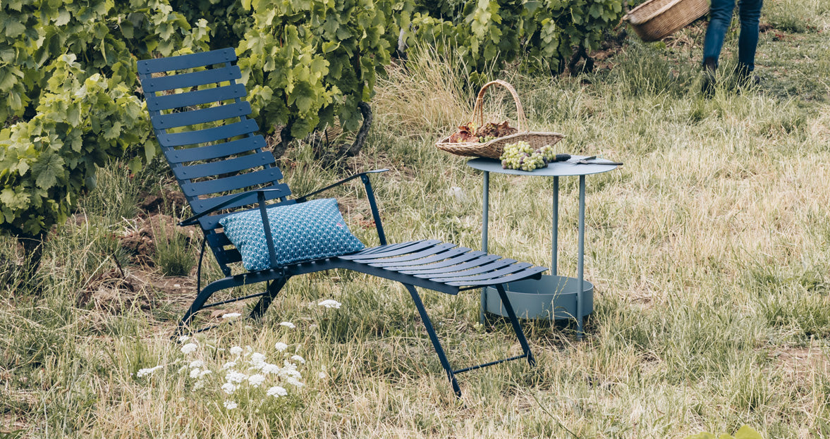Salsa Side Table by Fermob, showing of side table with chair in the live shot.