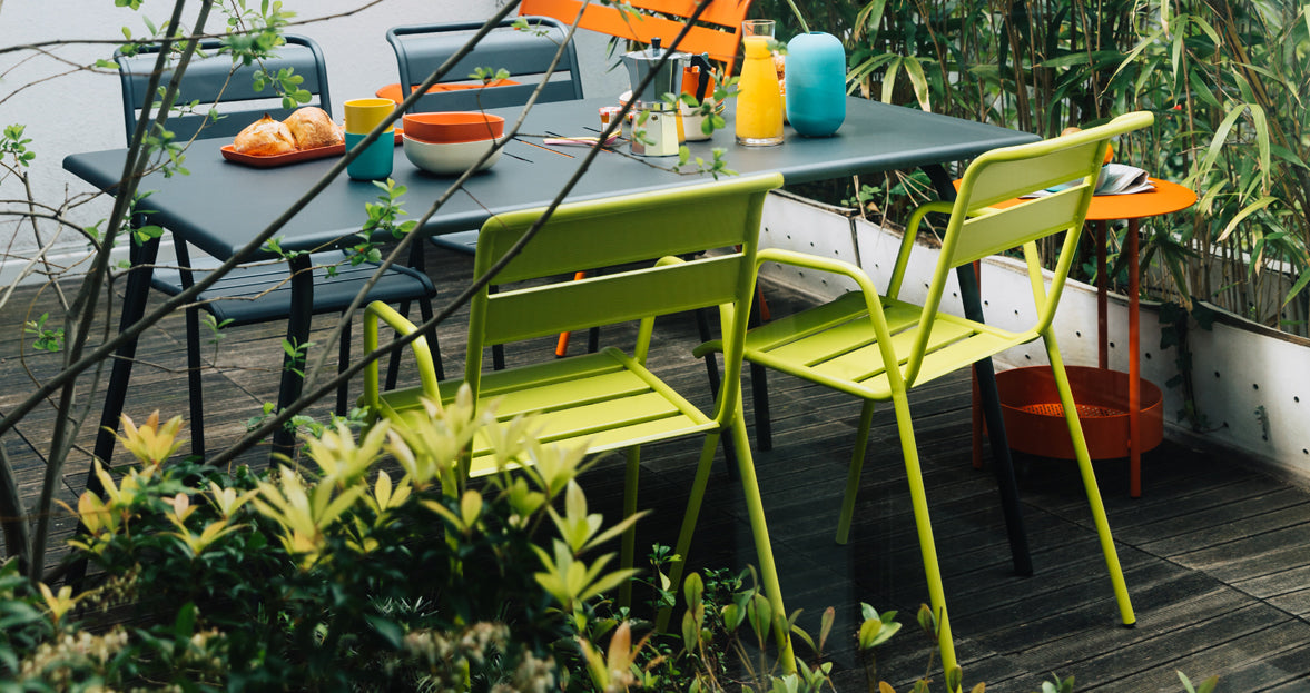Salsa Side Table by Fermob, showing of side table with chairs in the live shot.