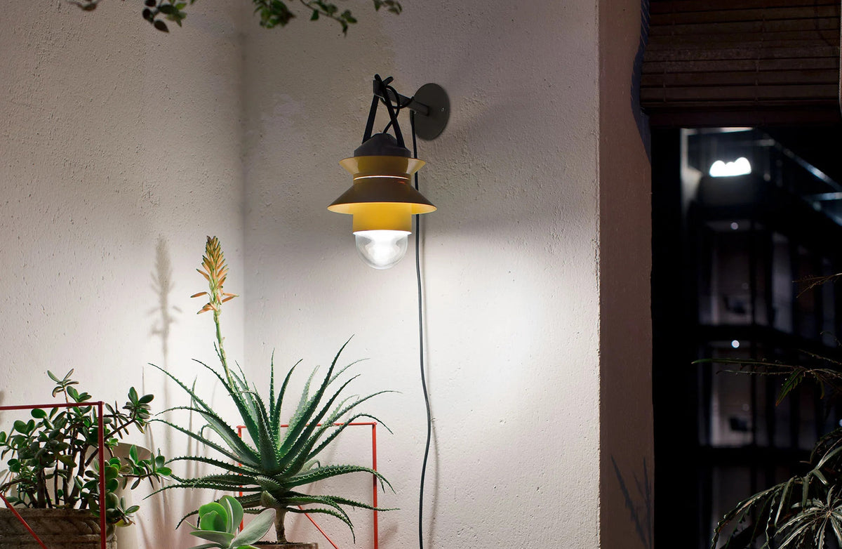 Santorini A Fixed Stem Wall Light by Marset, showing santorini a fixed stem wall light with wall bracket accessory in live shot.
