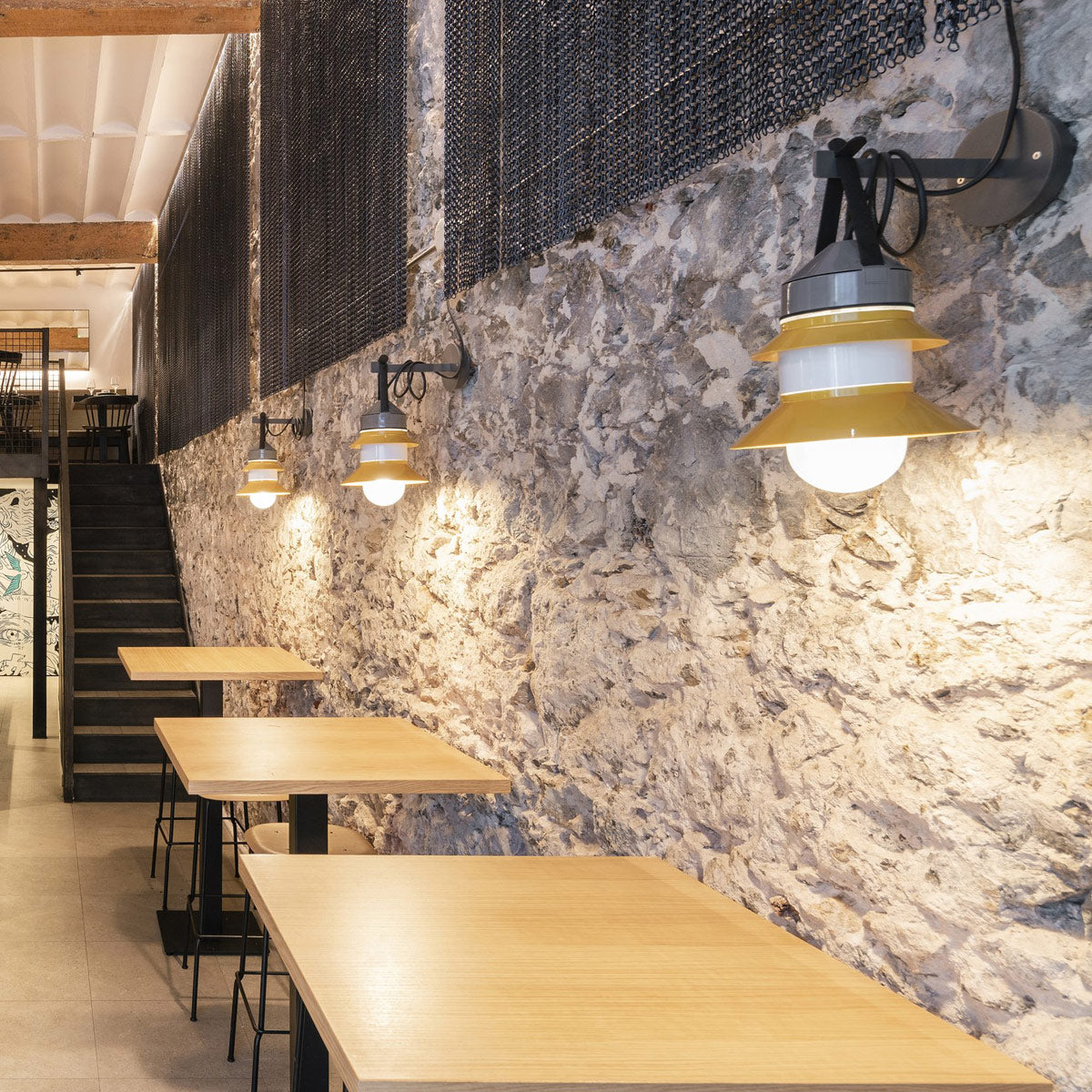 Santorini A Fixed Stem Wall Light by Marset, showing santorini a fixed stem wall lights with wall bracket accessories in live shot.