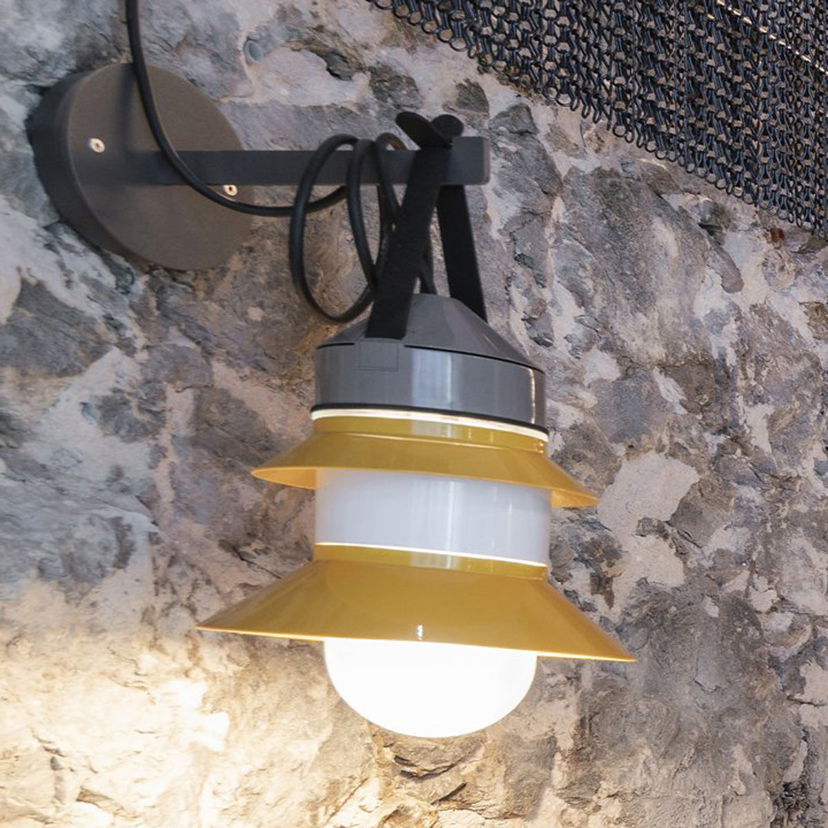 Santorini A Fixed Stem Wall Light by Marset, showing santorini a fixed stem wall light with wall bracket accessory in live shot.