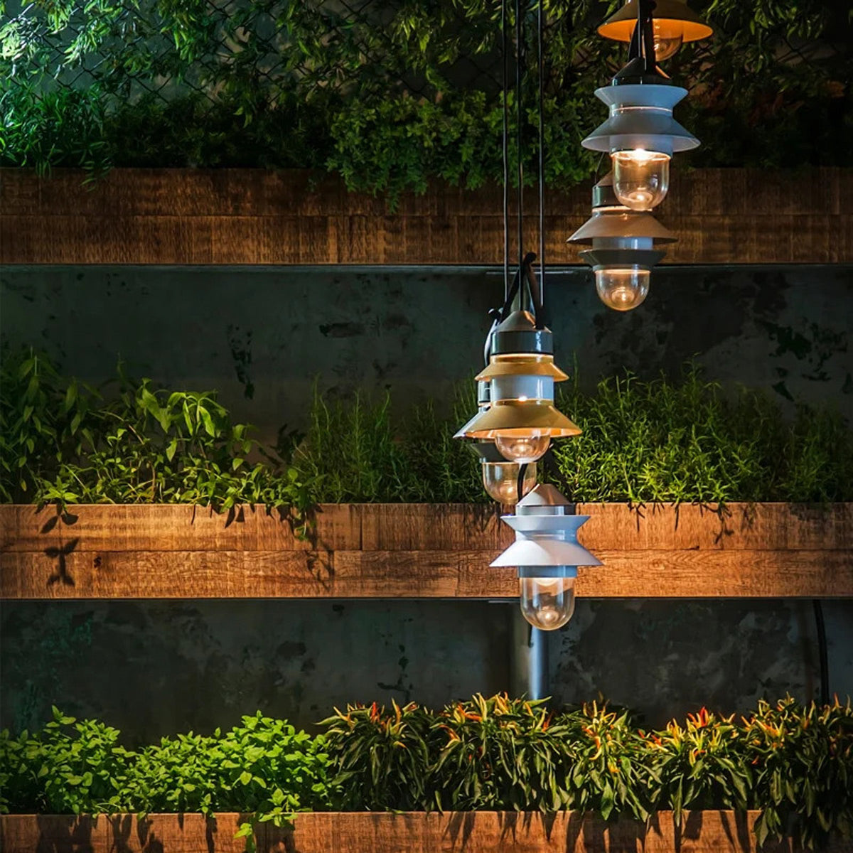 Santorini Outdoor Pendant by Marset, showing santorini outdoor pendants in live shot.