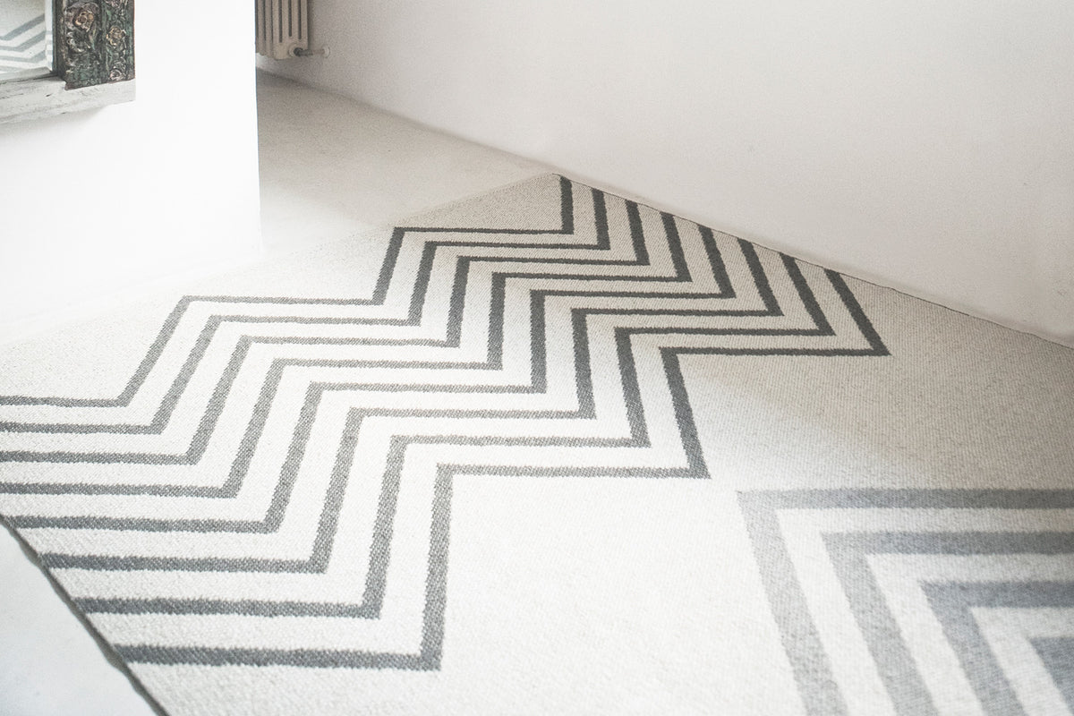 Sapmi Woven Plastic Rug by Brita, showing closeup view of sapmi woven plastic rug in live shot.