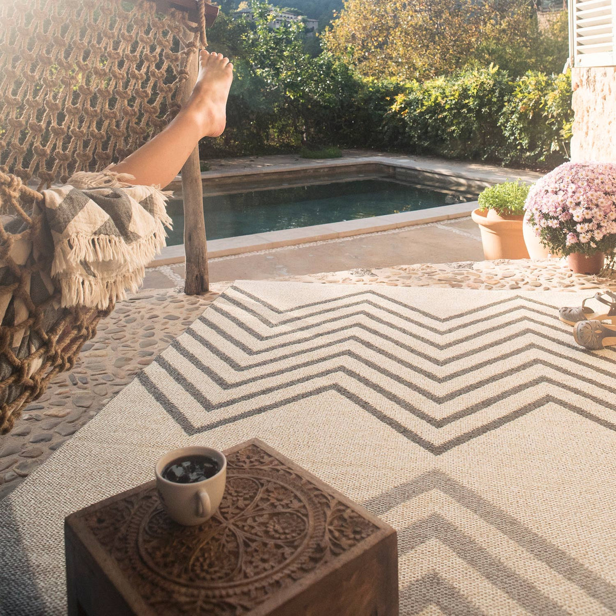 Sapmi Woven Plastic Rug by Brita, showing closeup view of sapmi woven plastic rug in live shot.