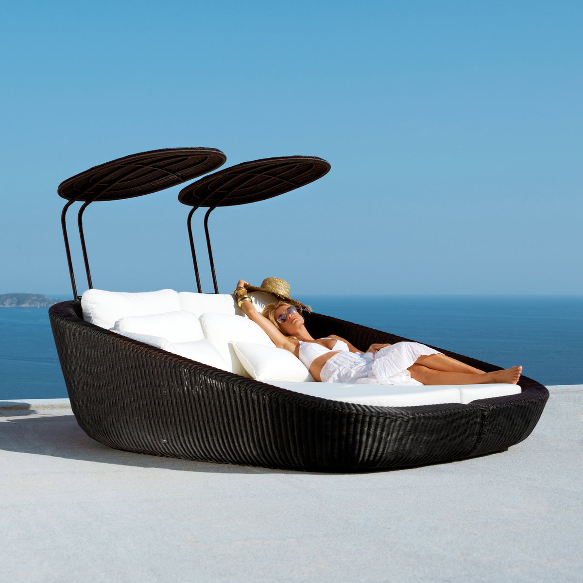 Savannah Daybed Left Module by Cane-Line, showing savannah daybed left module with right module in live shot.