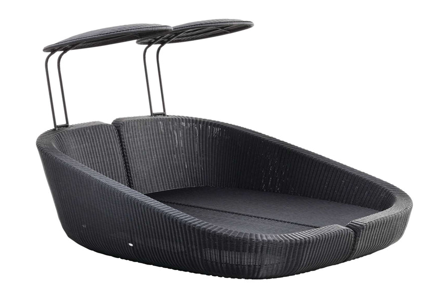 Savannah Daybed Right Module by Cane-Line, showing angle view of savannah daybed right module with left module in black fiber weave/no cushion.