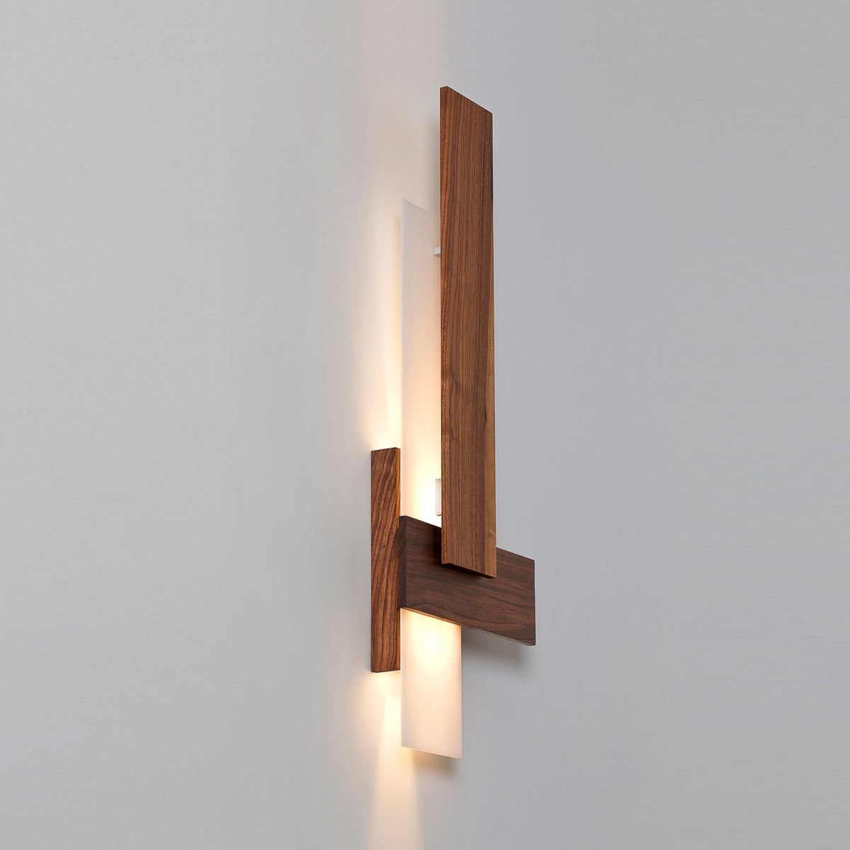 Sedo LED Sconce by Cerno, showing angle view of sedo led sconces in walnut wood.