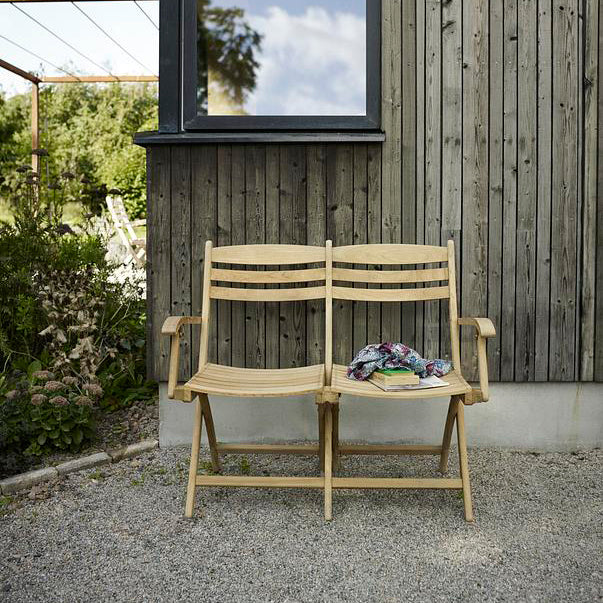 Selandia Outdoor 2-Seater Chair by Skagerak, showing selandia outdoor 2-seater chair in live shot.