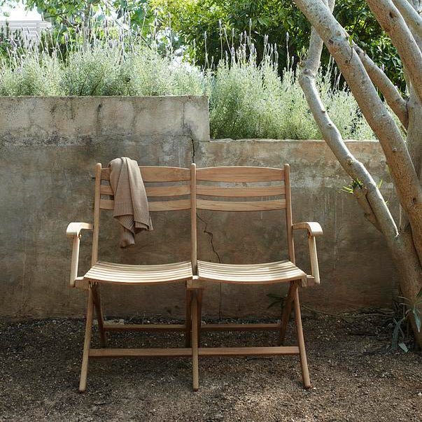 Selandia Outdoor 2-Seater Chair by Skagerak, showing selandia outdoor 2-seater chair in live shot.