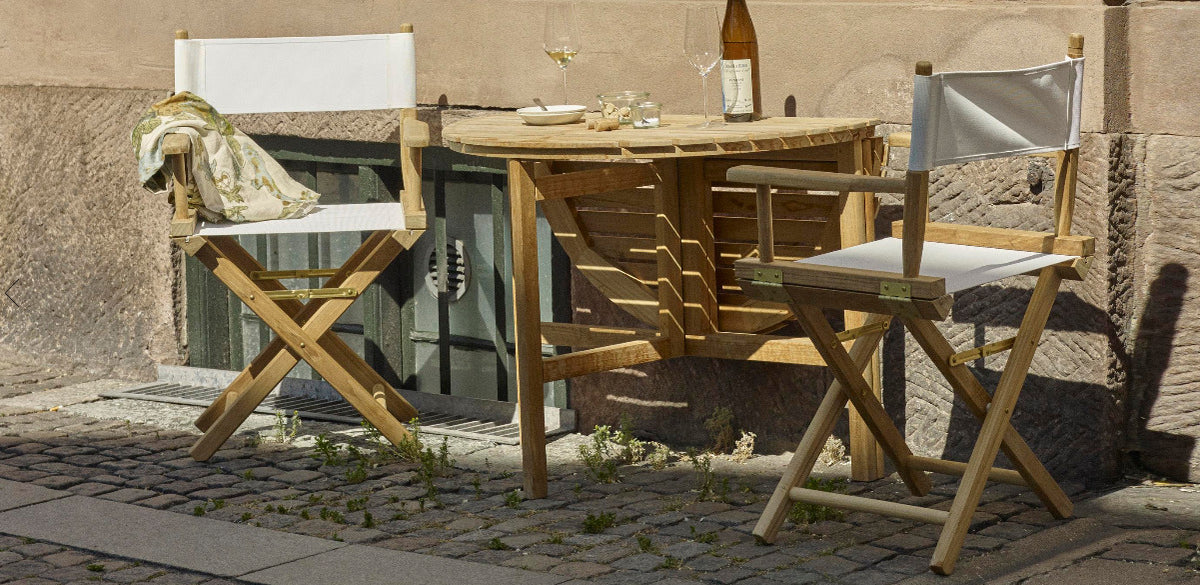 Selandia Outdoor Dining Table by Skagerak, showing selandia outdoor dining table with chairs in live shot.