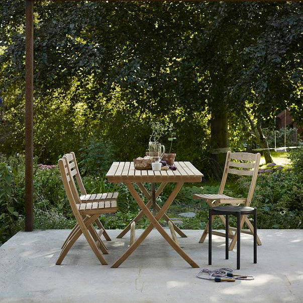 Selandia Outdoor Dining Table by Skagerak, showing selandia outdoor dining table with chairs & stool in live shot.