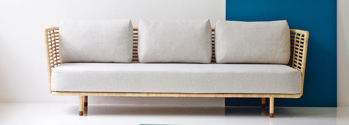 Sense Indoor 3-seater Sofa by Cane-Line, showing sense indoor 3-seater sofa in live shot.