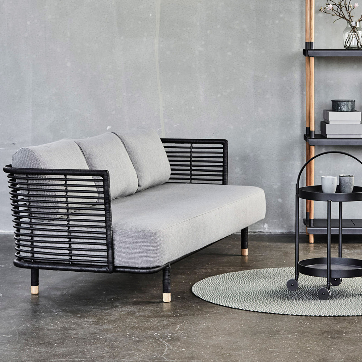 Sense Indoor 3-seater Sofa by Cane-Line, showing sense indoor 3-seater sofa with trolley in live shot.