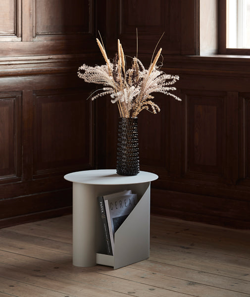 Sentrum Side Table by Woud, showing sentrum side table in live shot.
