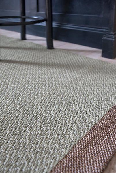 Shade Woven Plastic Rug by Brita, showing closeup view of shade woven plastic rug in live shot.