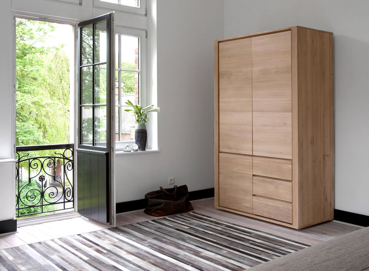 Shadow Dresser by Ethnicraft, Showing side view of oak dresser in the live shot.