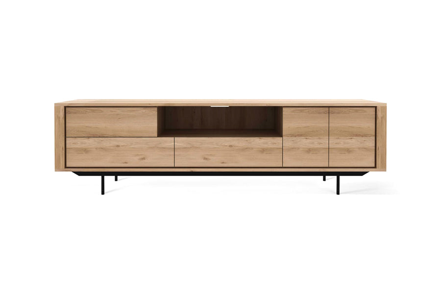 Shadow TV Cupboard by Ethnicraft, showing front view of shadow oak tv cupboard in oak/2 drawers 2 door-1 flip-down door.