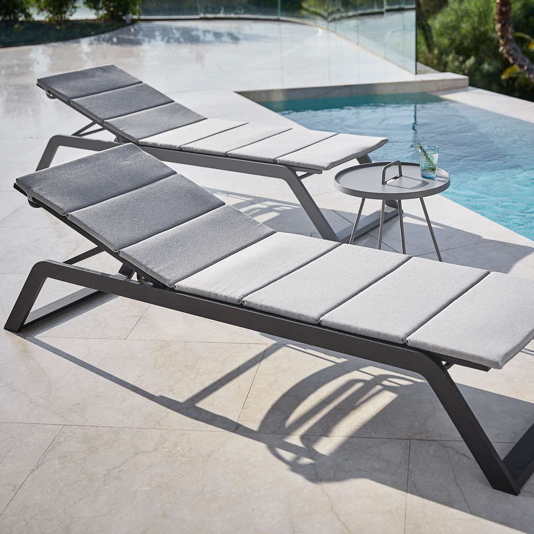 Siesta Sunbed by Cane-Line, showing siesta sunbeds in live shot.