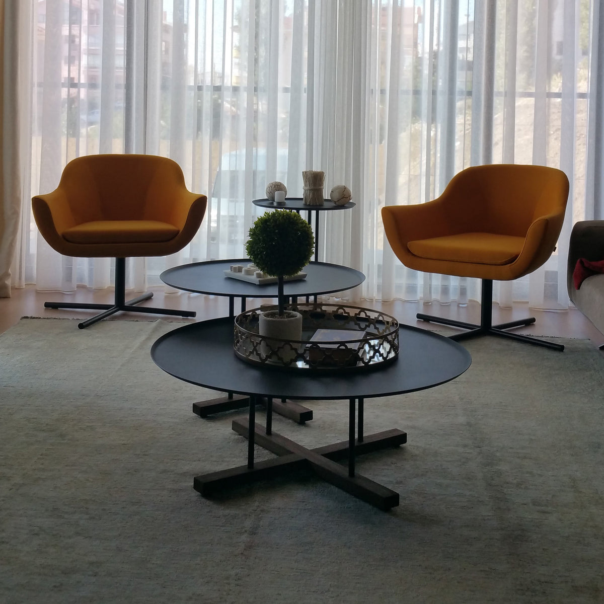 Sini Round Coffee Table by B&T, showing sini round coffee tables in live shot.