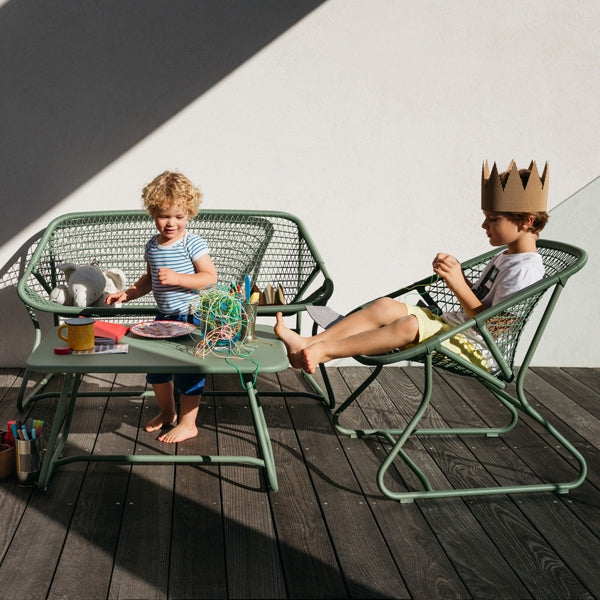 Sixties Bench by Fermob, showing bench with chairs & table in live shot.