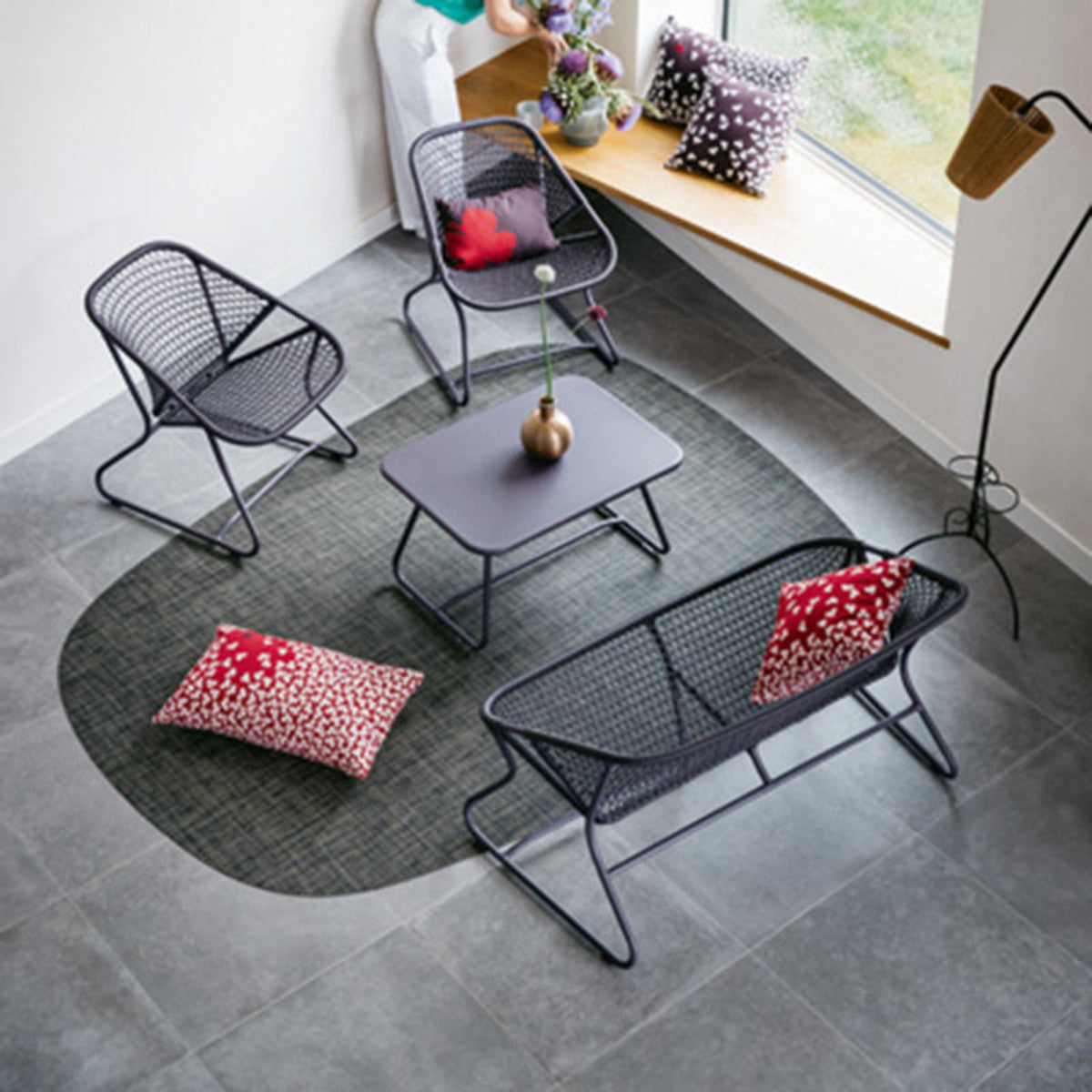 Sixties Bench by Fermob, showing top view of the bench with table in the live shot.