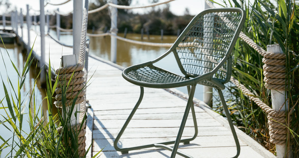Sixties Side Chair by Fermob, showing angle view of side chair in the live shot.
