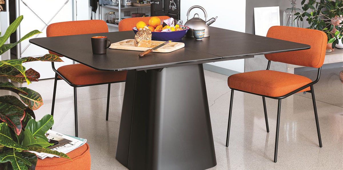 Sixty Chair by Connubia, showing sixty chairs with table in live shot.