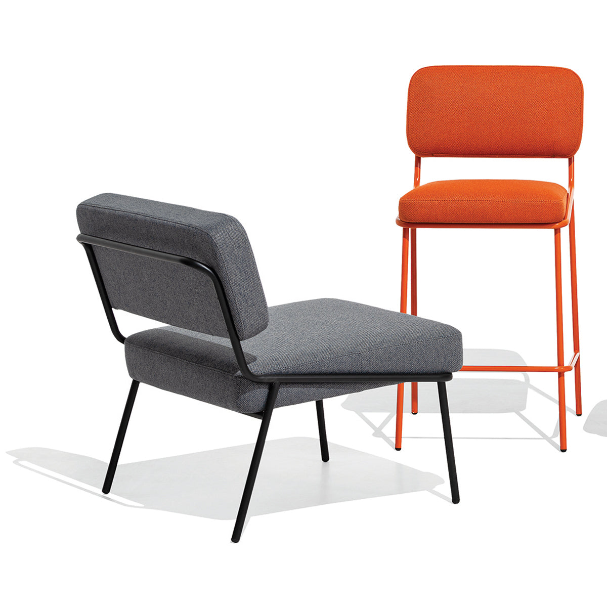 Sixty Counter Stool by Connubia, showing front view of sixty counter stool with lounge chair.