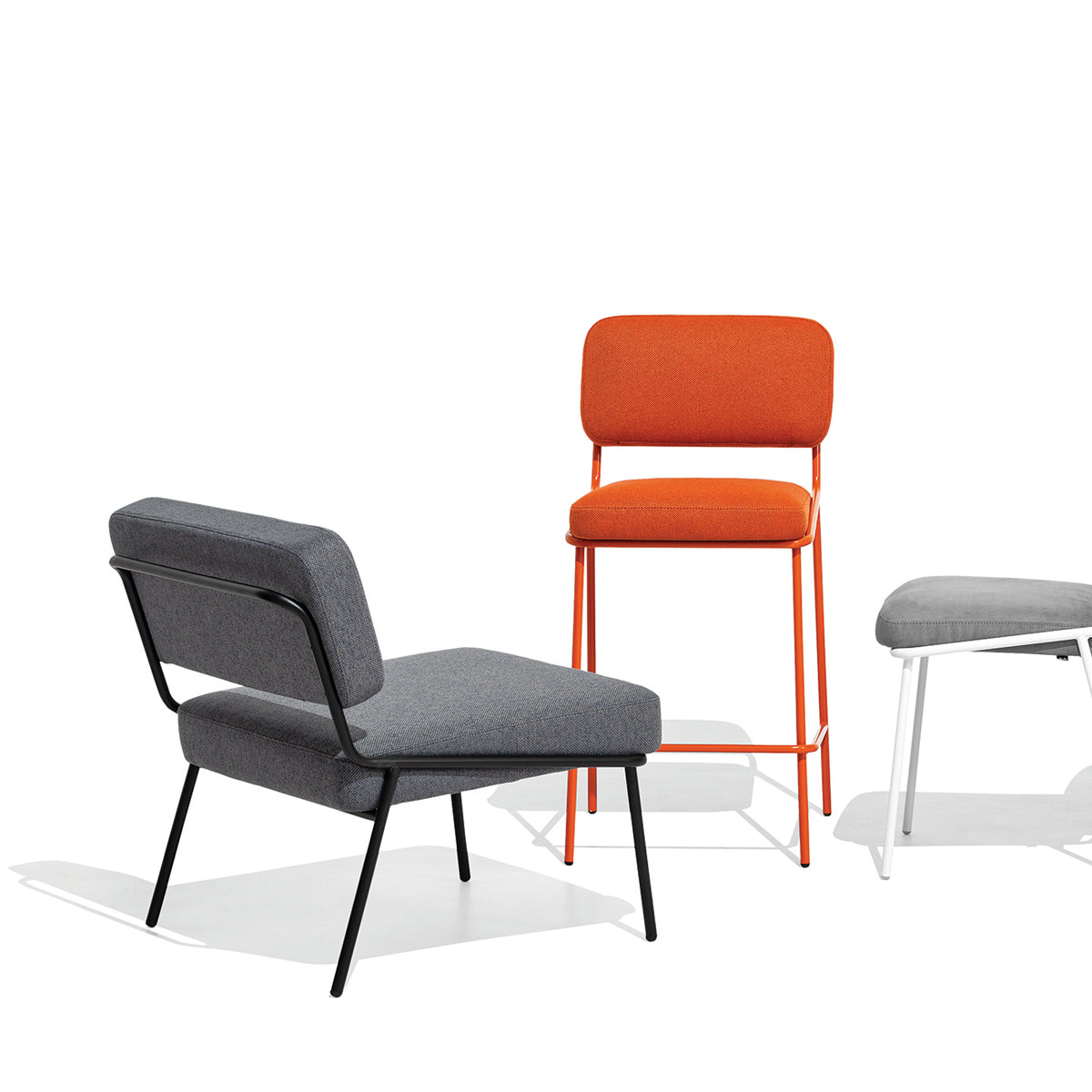 Sixty Lounge Chair by Connubia, showing back view of sixty lounge chair in matt black metal frame/black cros upholstery with chair & stool.