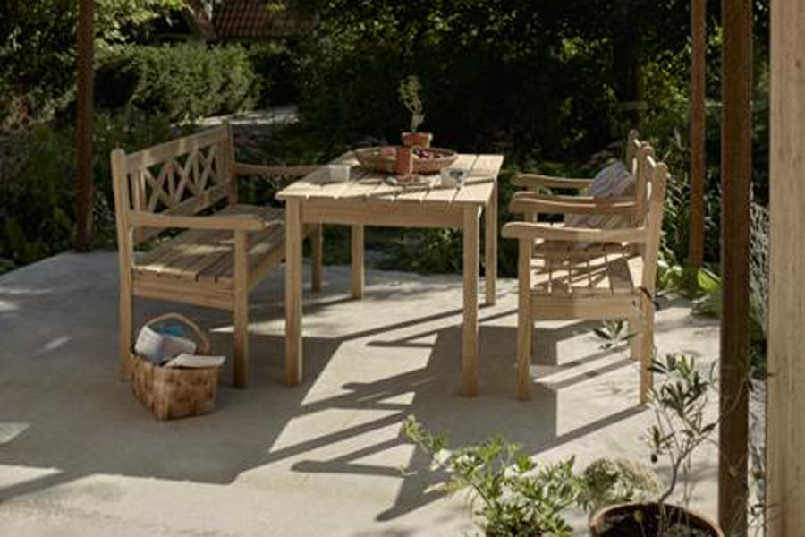 Skagen Chair by Skagerak, showing skagen chairs with bench & table in live shot.