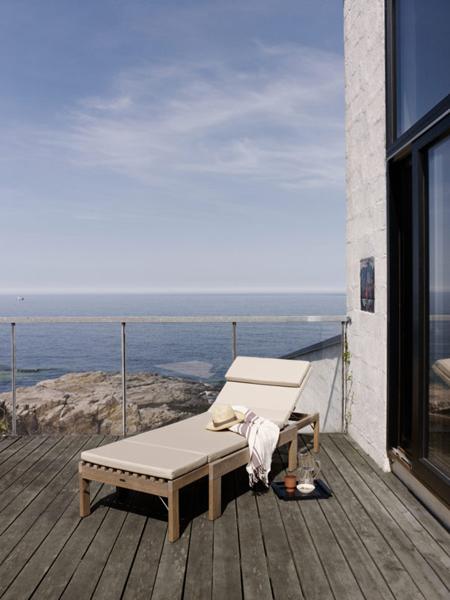 Riviera Sunlounger by Skagerak, showing riviera sunlounger with cushion in live shot.
