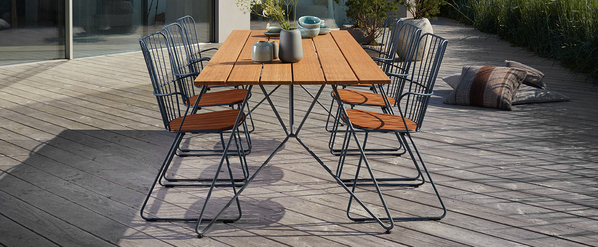 Sketch Outdoor Dining Table by Houe, showing sketch outdoor dining table with chairs in live shot.