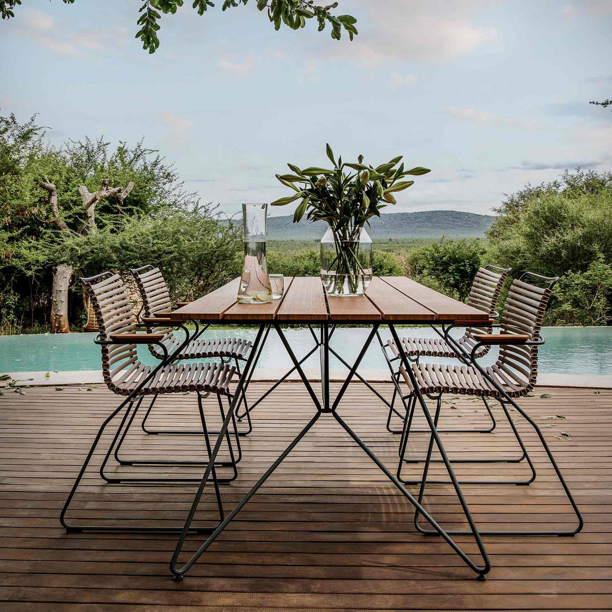 Sketch Outdoor Dining Table by Houe, showing sketch outdoor dining table with chairs in live shot.
