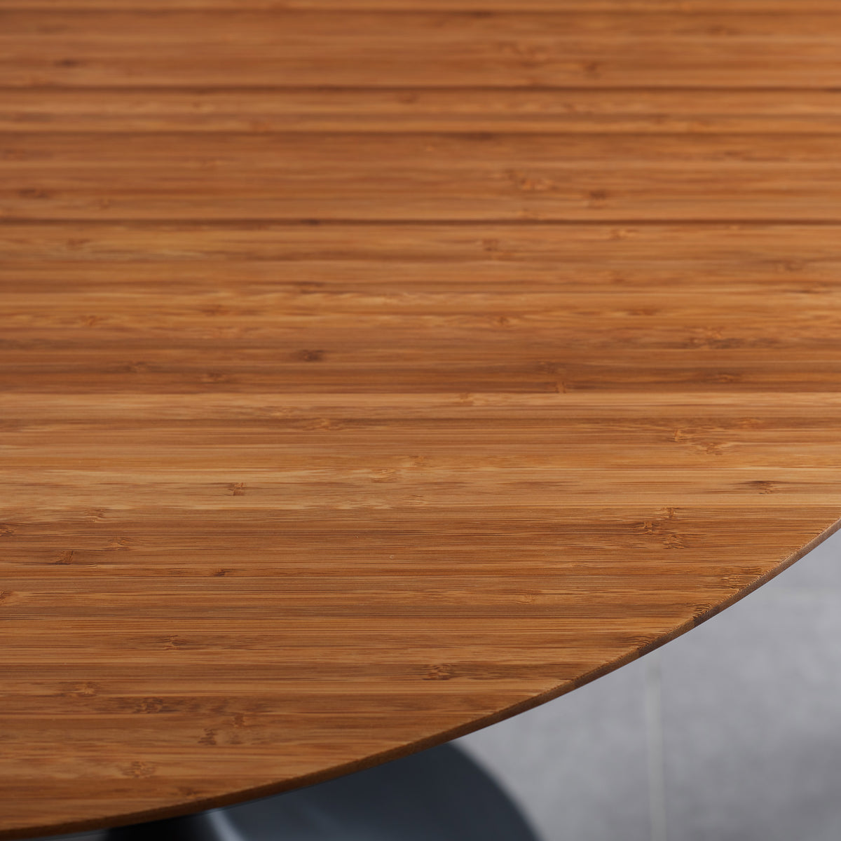 Soho 36" Amber Round Dining Table by Greenington, showing closeup view of soho 36" amber round dining table in live shot.