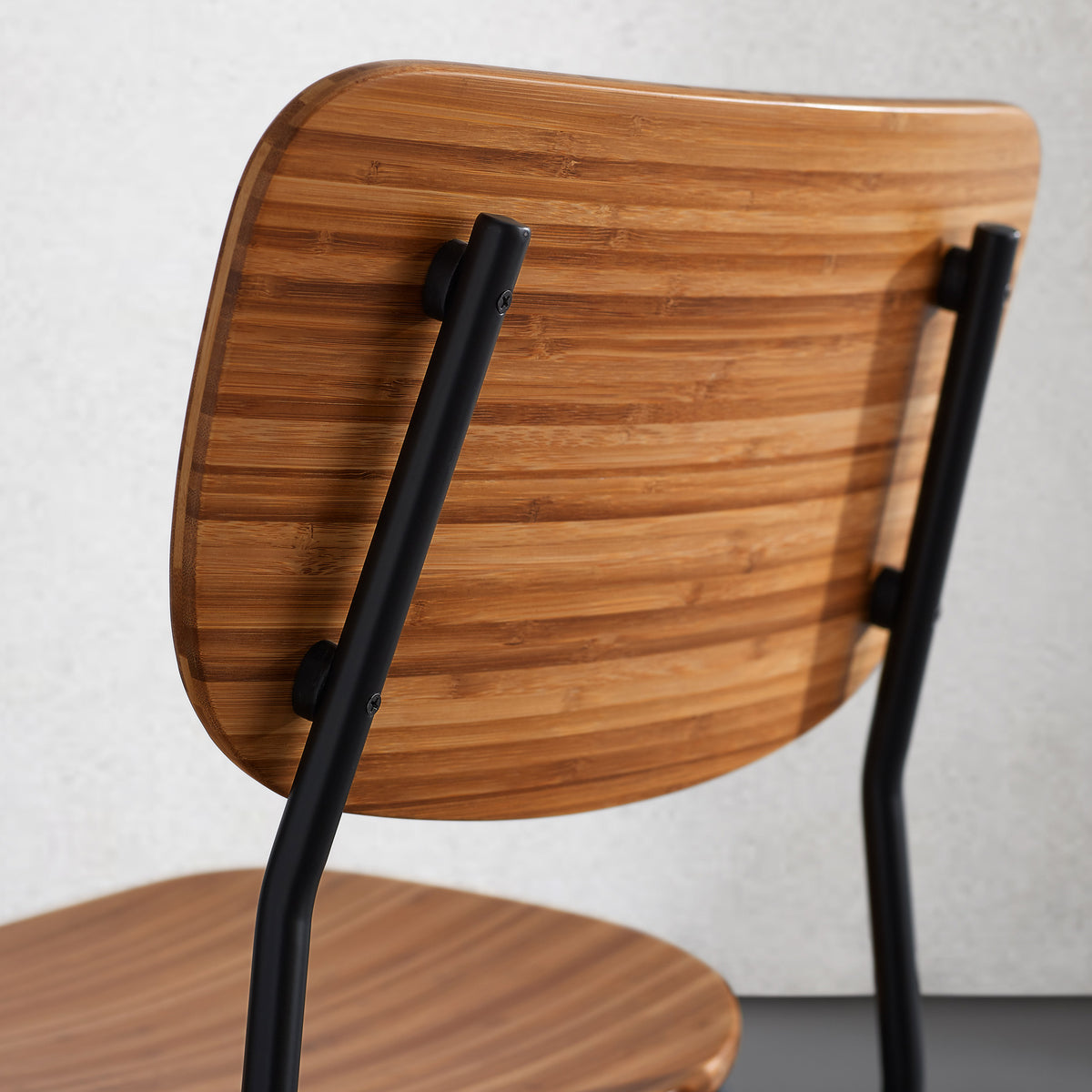 Soho Amber Dining Chair by Greenington, showing closeup view of amber dining chair in live shot.