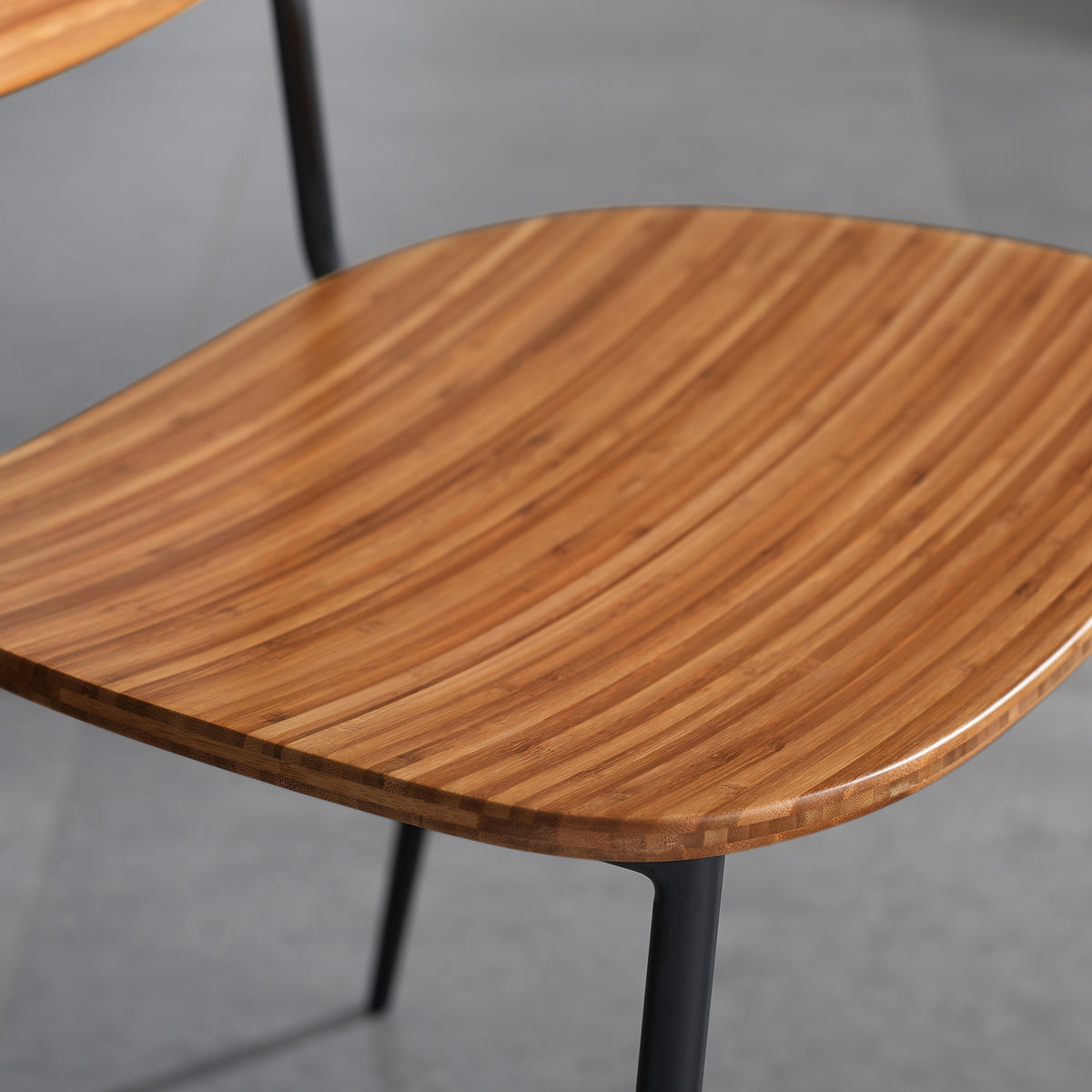 Soho Amber Dining Chair by Greenington, showing closeup view of amber dining chair in live shot.