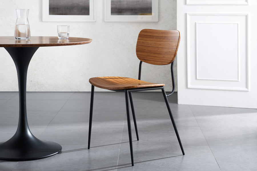 Soho Amber Dining Chair by Greenington, showing amber dining chair with table in live shot.