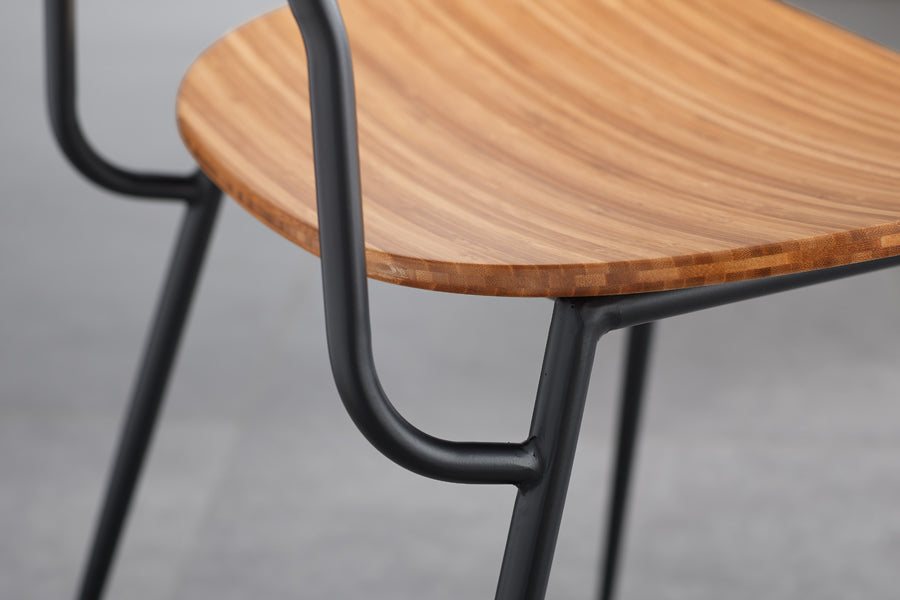 Soho Amber Dining Chair by Greenington, showing closeup view of amber dining chair in live shot.