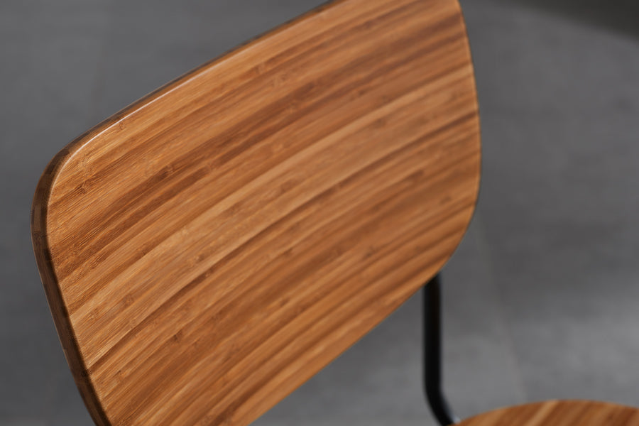 Soho Amber Dining Chair by Greenington, showing closeup view of amber dining chair in live shot.
