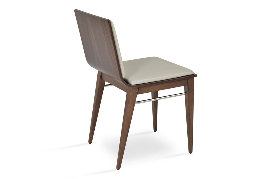 Corona Wood Dining Chair by SohoConcept, showing angle view in light grey leatherette pad with american walnut veneer base.