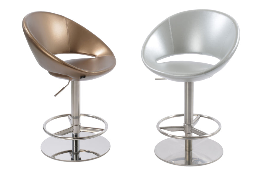 Crescent Piston Stool by SohoConcept, showing angle view of two chairs in gold & silver ppm with polished & brushed stainless steel (full footrest) base.