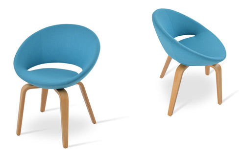 Crescent Plywood Dining Chair by SohoConcept, showing different angles view of crescent plywood dining chairs in camira blazer turquoise wool with natural finish.