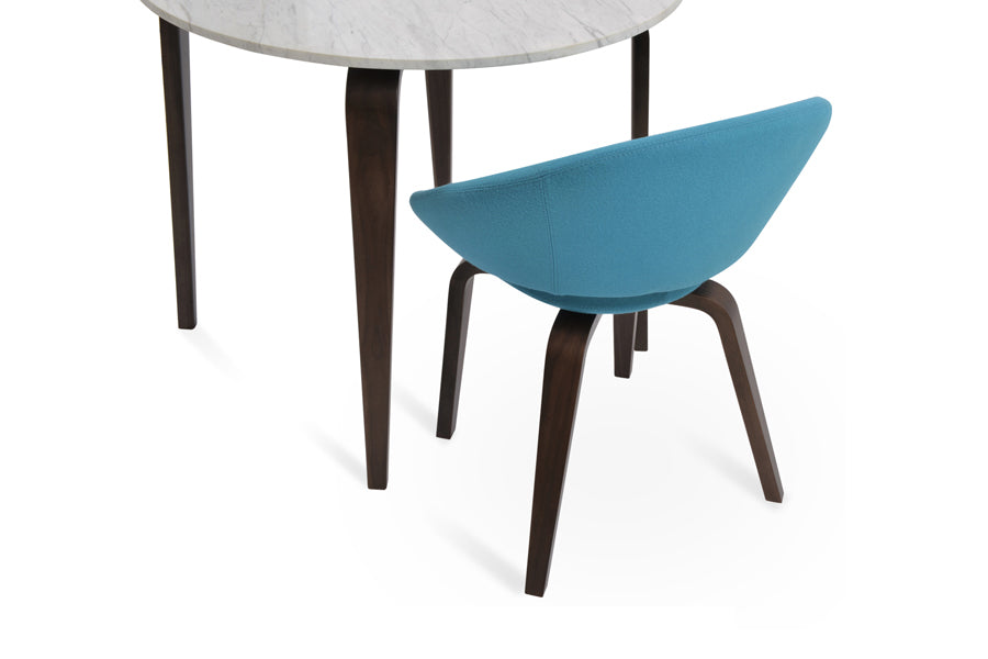 Crescent Plywood Dining Chair by SohoConcept, showing back view of crescent plywood dining chair in camira blazer turquoise wool with walnut verneer & chanelle marble dining table.