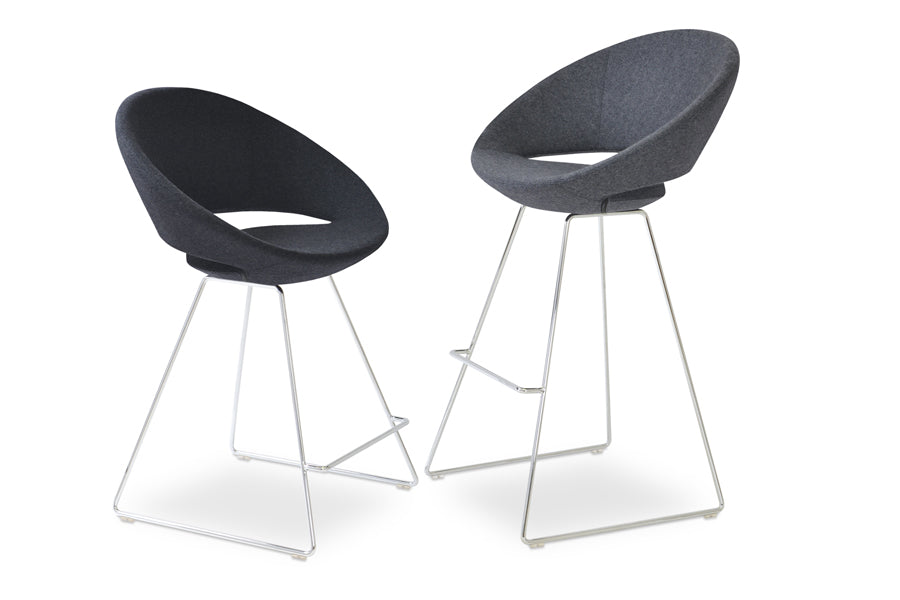 Crescent Wire Counter Stool by SohoConcept, showing angle view of counter & bar stools in charcoal wool with chrome base.