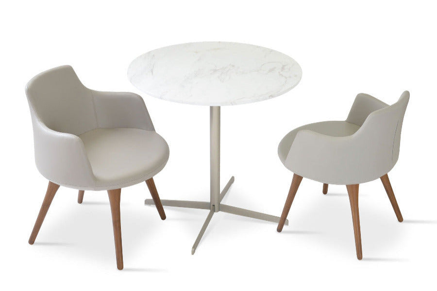 Dervish Wood Dining Chair by SohoConcept, showing angle view of two wood dining chairs and dining table in bone leatherette and diana marble dining table.