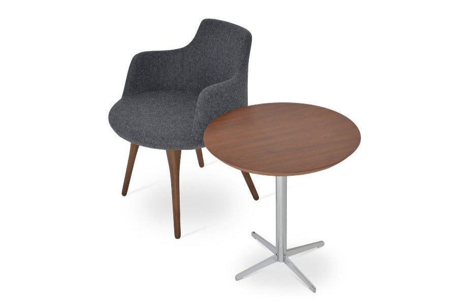 Dervish Wood Dining Chair by SohoConcept, showing angle view of wood dining table and end table in camira blazer dark grey wool and diana walnut end table.