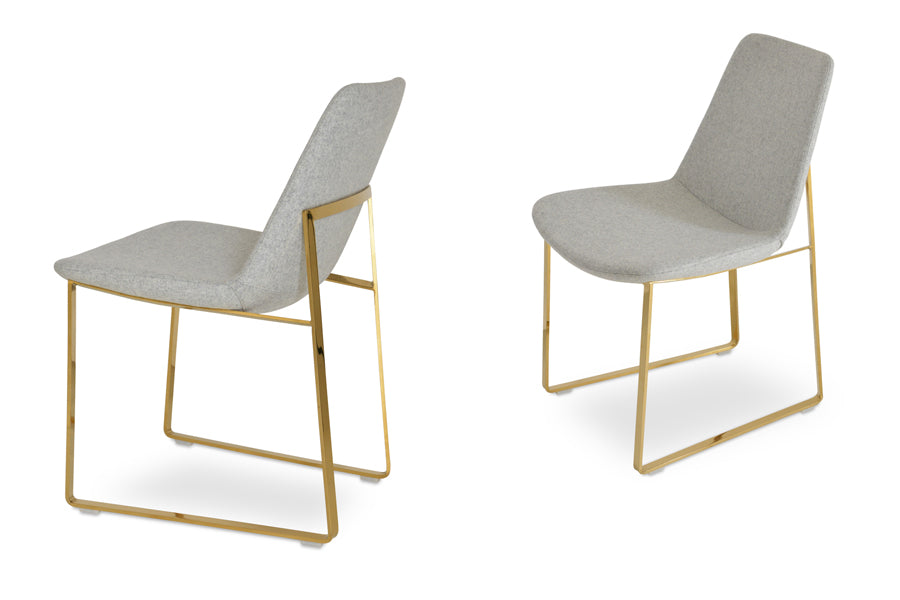 Eiffel Sled Chair by SohoConcept, showing angle view of two chairs in camira blazer silver wool with gold brass base.